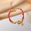 สร้อยข้อมือเชือกสีแดงนำโชคพร้อมจี้หัวเข็มขัดทองคำ