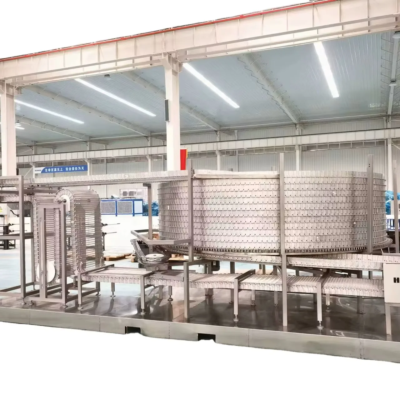 High-efficiency spiral freezers for meat, seafood and prepared food processing lines