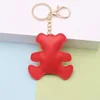Hebilla de cadena dorada-oso-rojo