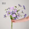 Purple amaryllis and dark purple dandelion bulb bouquet