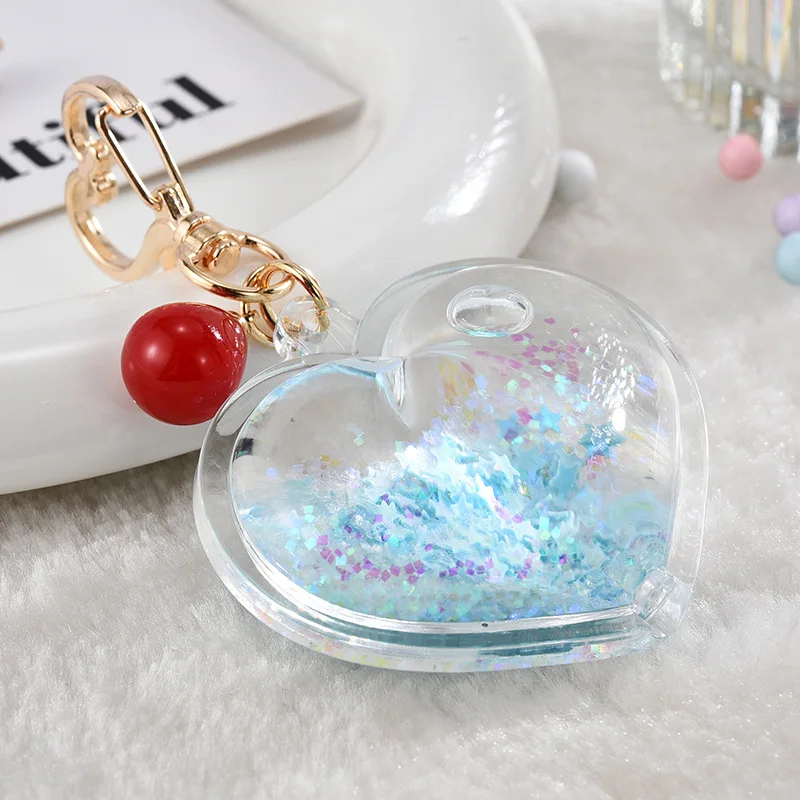 Hot sale heart shape double side transparent plastic keychain glitter fluid acrylic keychain for gifts supplier