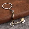 Patinete de bronce antiguo