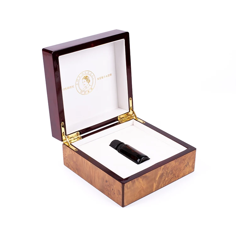 Open box with a dark bottle inside