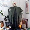 A standing female ghost with a skeleton