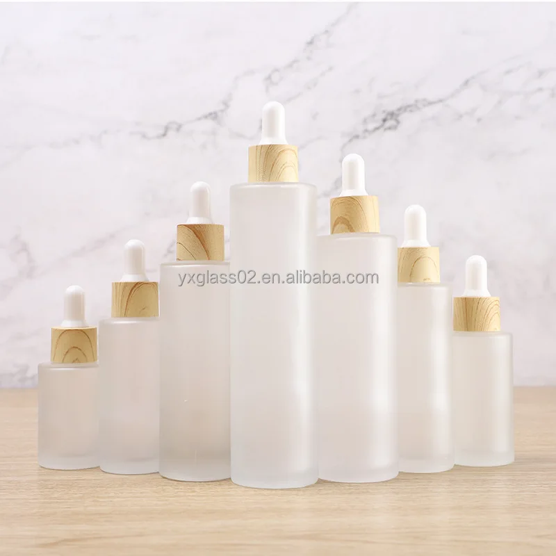 Frosted Essential Oil glass bottle serum glass bottle Flat Shoulder Dropper bottle with Plastic environmentally wood grain ring supplier