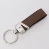Cuero marrón oscuro en blanco, grabado con láser, metal PLS090-BN