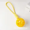 Yellow hollow ball with rope, approximately 97g, 40cm.