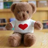 Maglione con cuore bianco e orsetto marrone con palpebre
