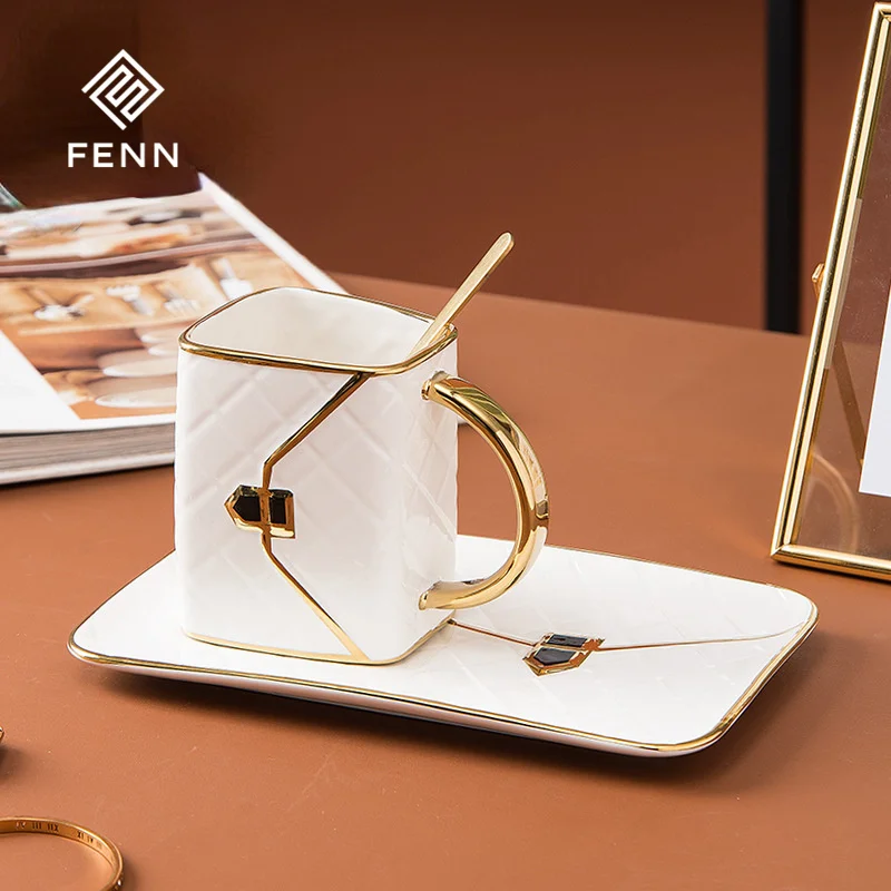 product fenn elegant novelty bag design glossy glaze thick handles ceramic cups and saucers set with embossed  gold painting process-60