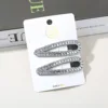 Conjunto de dos piezas con diamantes cuadrados y 4 gotas plateadas