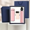 แก้วเก็บอุณหภูมิ LCD + เสื้อกันฝน + พาวเวอร์แบงค์แบบพกพา - สีชมพู