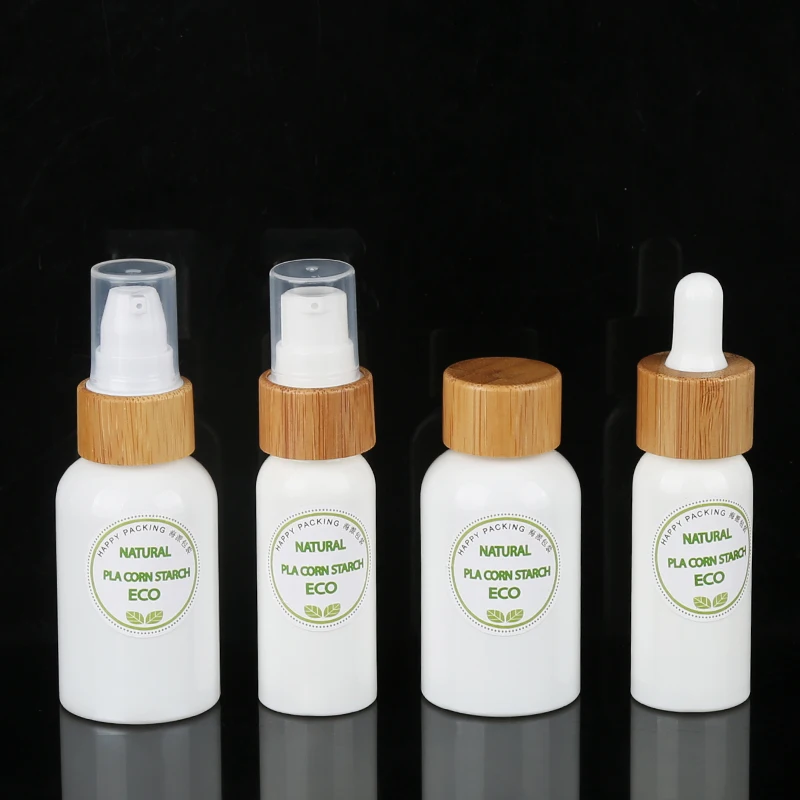 Natural 50ml 100ml PLA Material Polylactic Acid Biodegradable Lotion Bottle with Bamboo Cover for Shampoo
