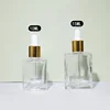 Clear bottle with gold dropper head