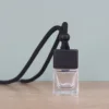 clear bottle +black wooden lid