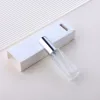 Clear glass spray bottle + silver cap + white box