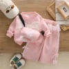 Set due pezzi rosa con borsa a fiocco grande e maniche lunghe