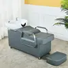 Light blue bed with white porcelain basin