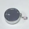 Charm de plata con incrustaciones de diamantes
