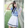 Women's blue top and white skirt