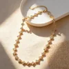 Four white diamonds with gold