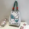 Sac à main anglais papillon beige