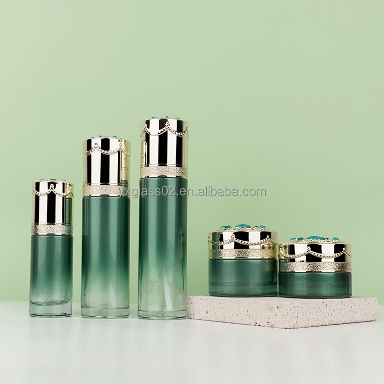 Cosmetic glass bottle set skincare cosmetic packaging glass container with Luxury lid carving craft pump spray cap factory