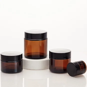 Stock 5 10 20g 30 50 60 100 150g 1oz Empty round amber glass jar Cosmetic Eye face Cream Glass container with black plastic lid