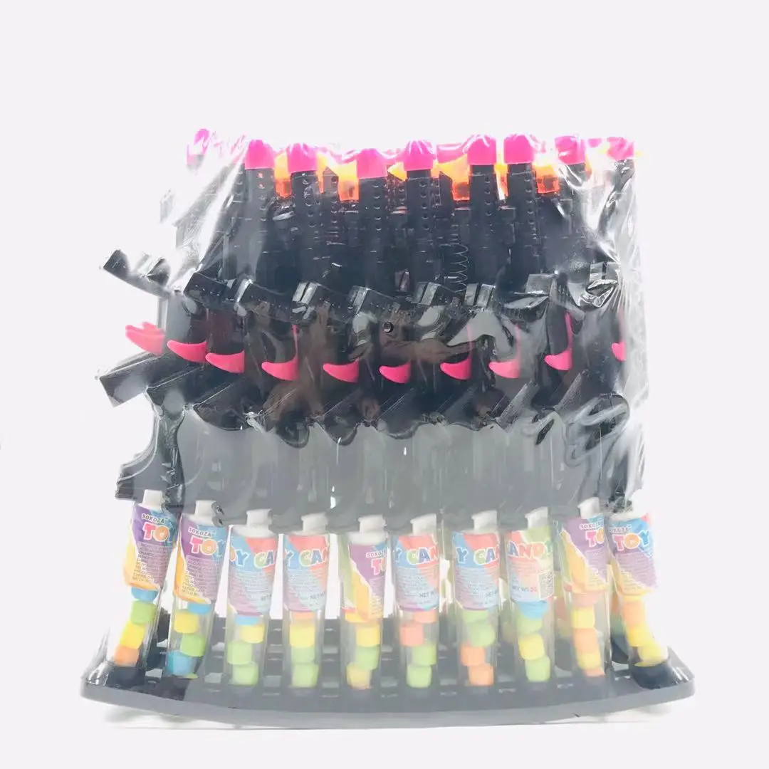 
 Игрушечные конфеты с черным пистолетом  