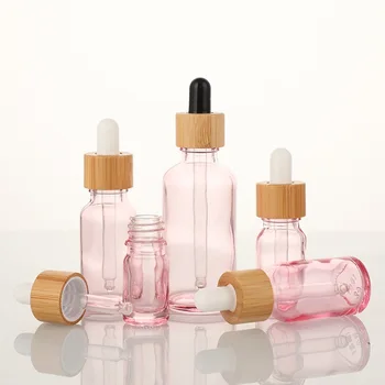 Custom color spray pink glass bottle 5ml 10ml 15ml 20ml 30ml 50ml 100ml serum essential Oil bottle bamboo Dropper for cosmetic