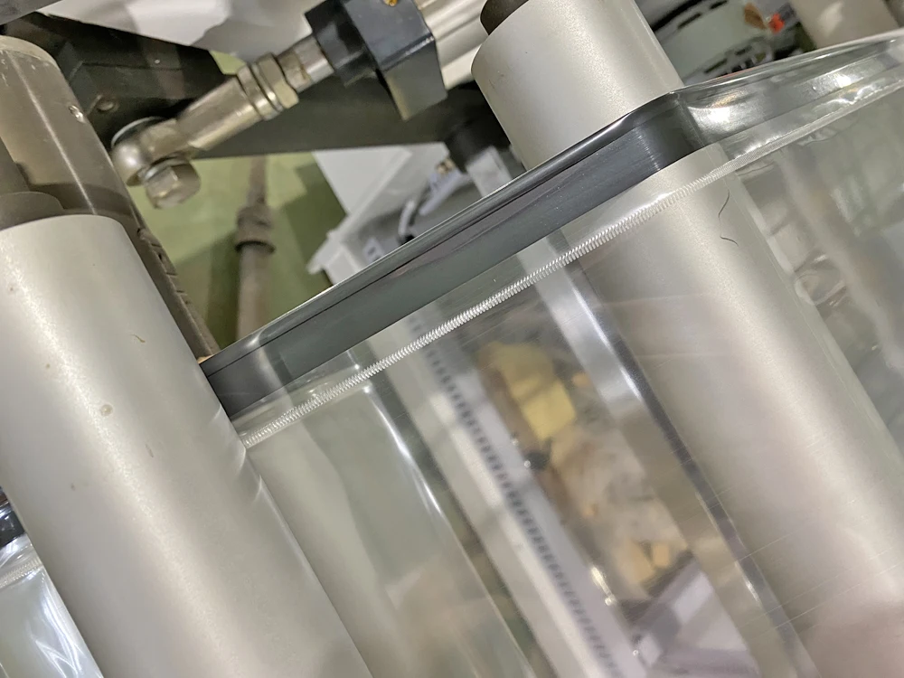 High Speed Poly Sheet Folding Melting Film Edge System Automatic Bag Making Machine Opp Bopp Bag Making Machine