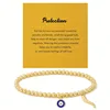 Golden beaded Devils Eye + card
