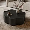 Table basse rotative à pétales en bois fumé noir veiné