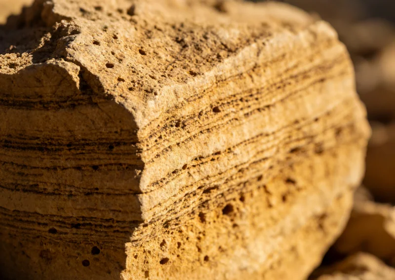 Sandstone - soft porous stone that contaminates hard stone blades