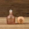 Tapa de madera en forma de bola marrón de 10 ml con logo del Árbol de la Vida