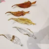 Single gold edged glass feather, size 20cm