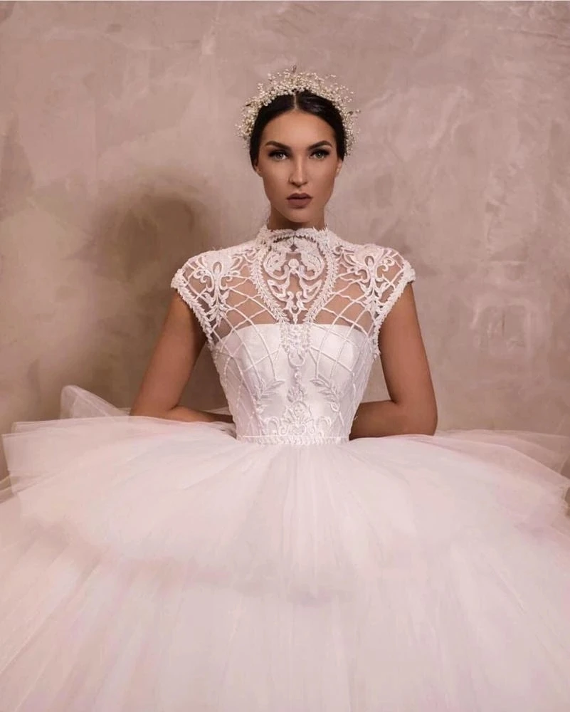 Shop Our Collection of Swan Lace Wedding Gowns for Plus Size