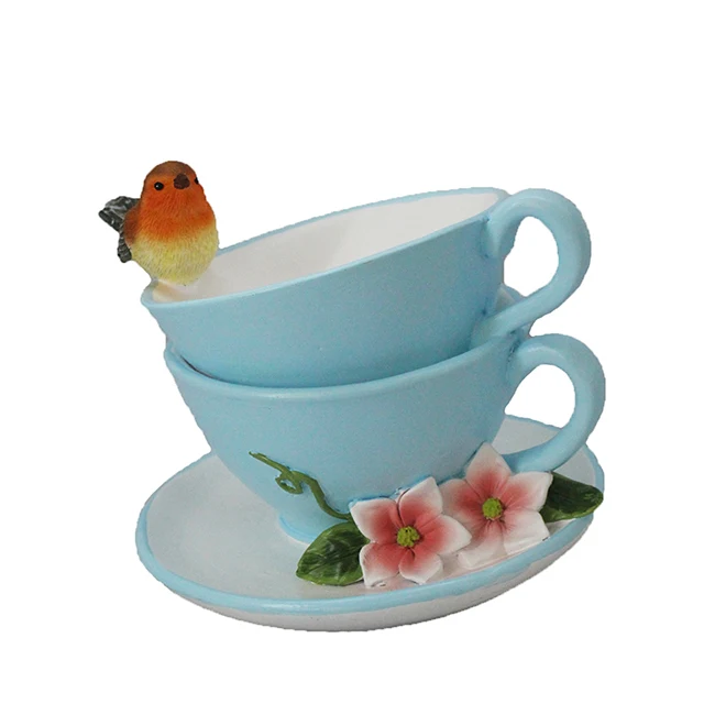 light blue resin tea cup shaped bird bath garden bird feeder