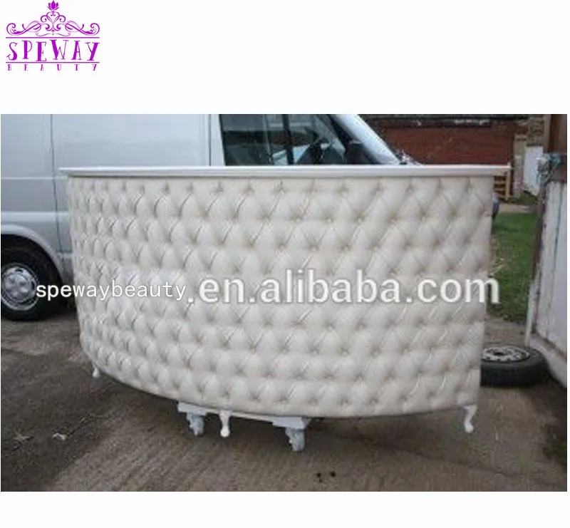 white tufted reception desk