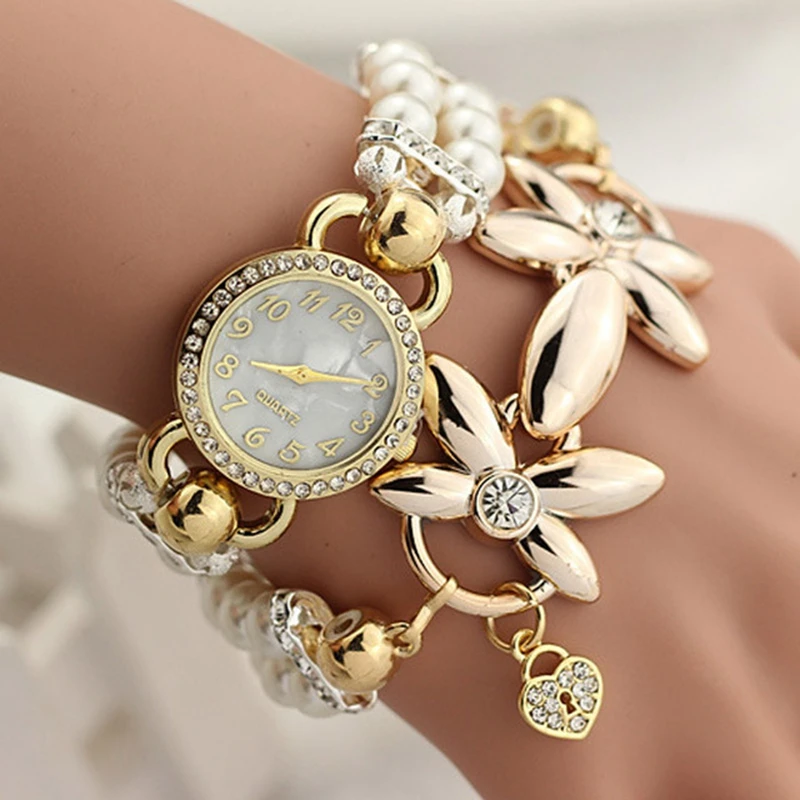 Женские золотые часы с камнями