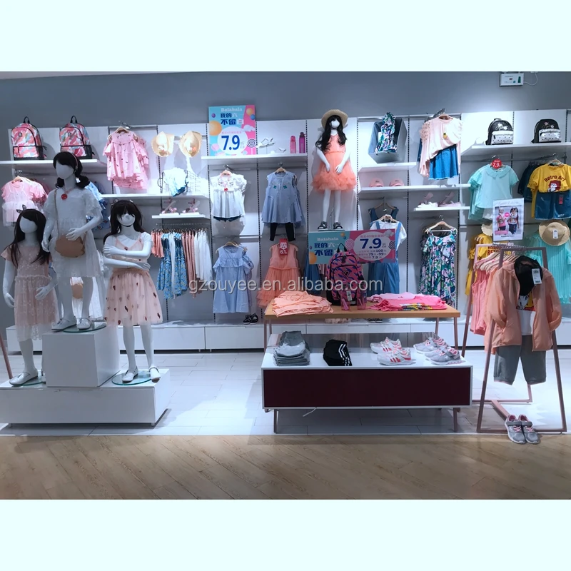 Exhibición de tienda de ropa moderna para niños, muebles de tienda