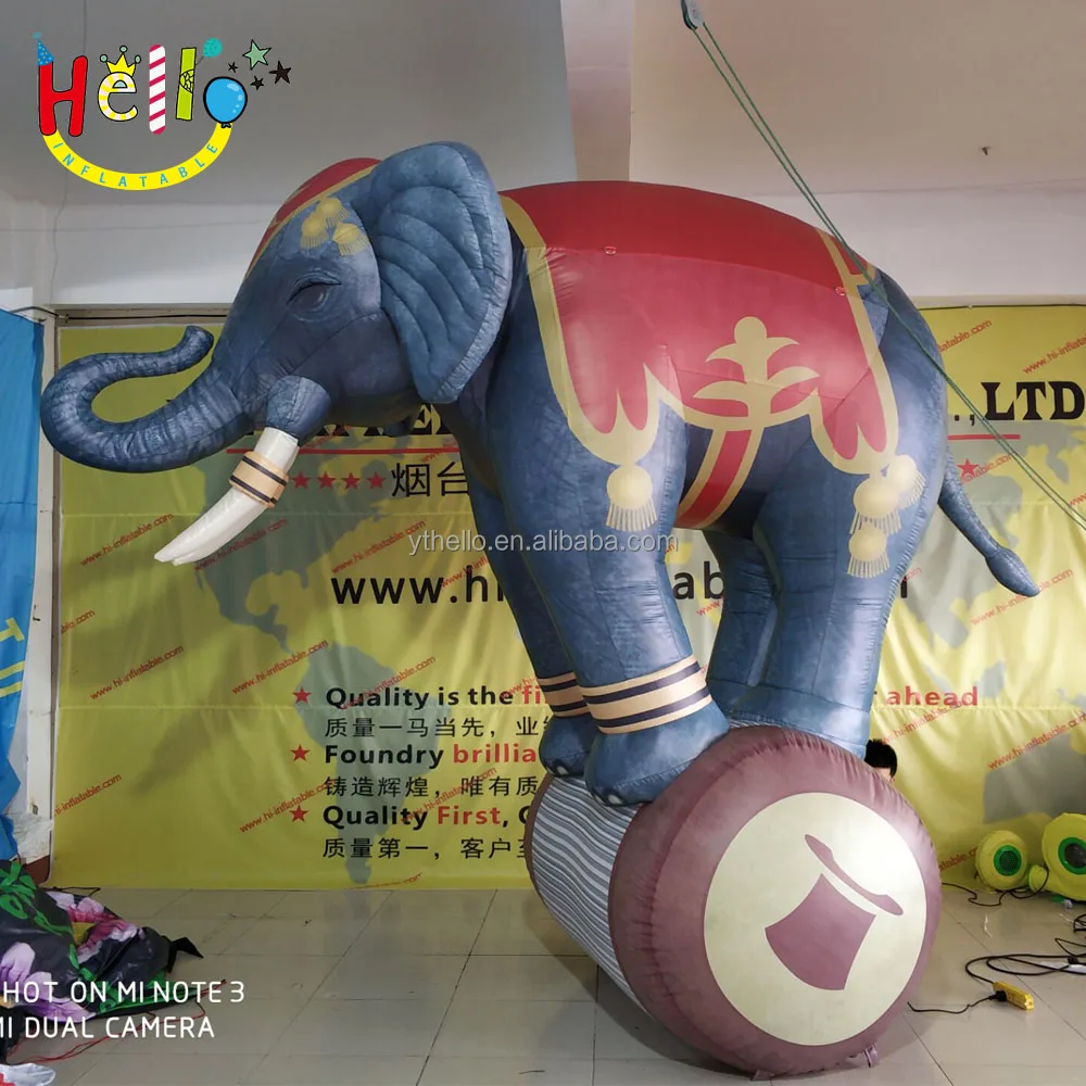 festival circus inflatable elephant animal standing on the Wooden barrel