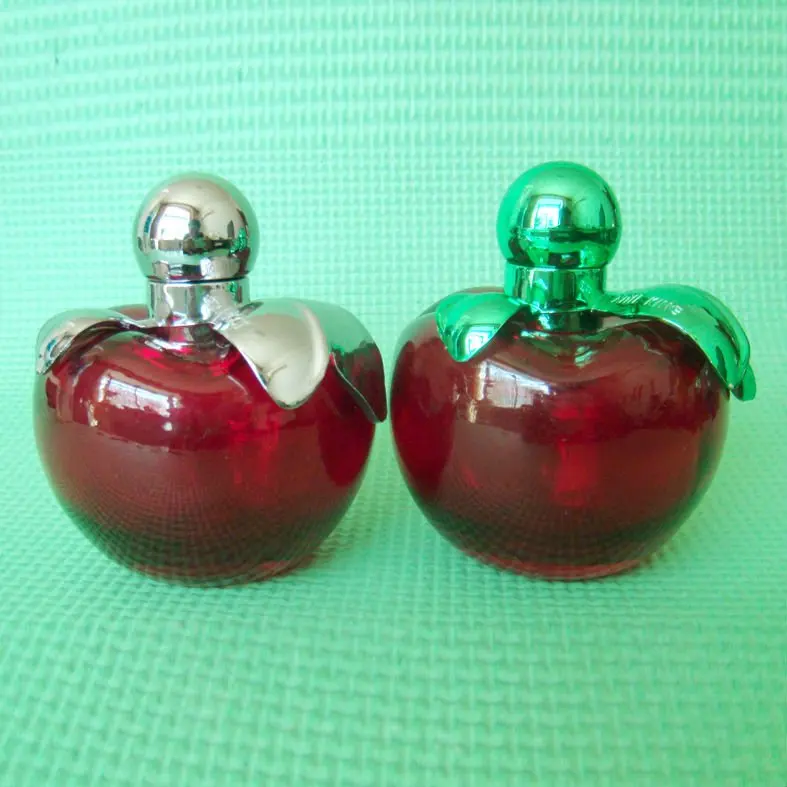 perfume in a green apple shaped bottle