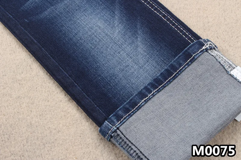 
Хорошо тянущаяся джинсовая ткань из хлопка и вискозы и спандекса с деформацией 