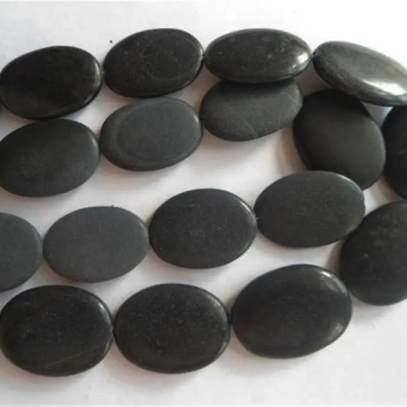 Черный матовый камень. Черный овальный камень. Черный круглый камень матовый. Черный камень пористый матовый.