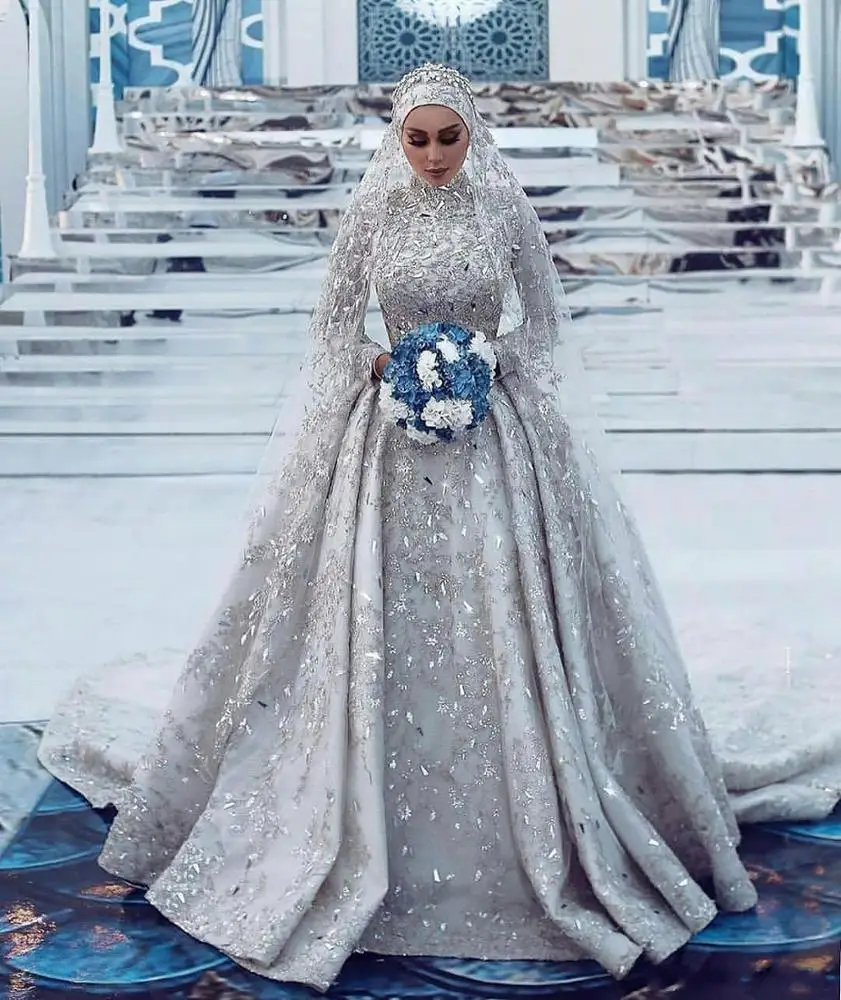 Classy hijab style wedding gown by safir al hijab FADEL JABER . Veil design  by @veilalsafir . Dress available for rent 📲 | Instagram