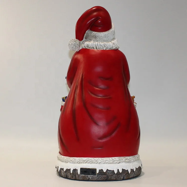 Wholesale Tabletop OEM Battery Led Illuminated Musical Resin Santa Claus Christmas Decoration with Moving Village Scene