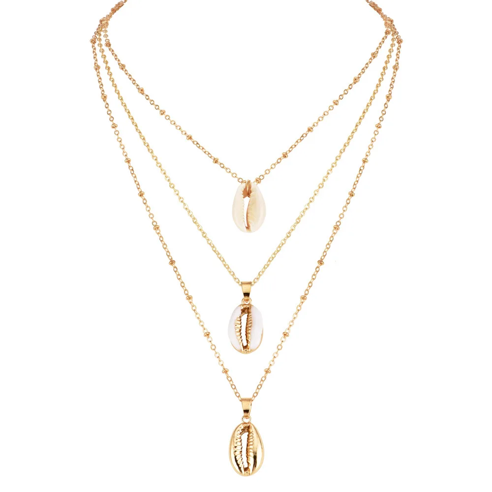 Xus Mini Pendant Necklace Golden Cowrie 