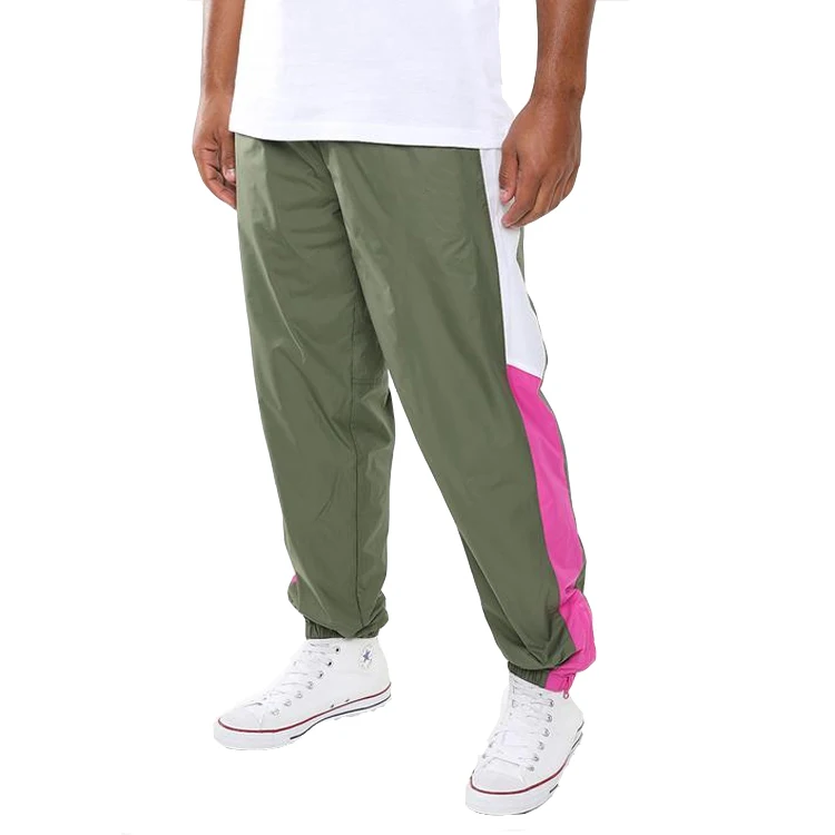 The North Face: Green Tek Piping Wind Trousers | SSENSE