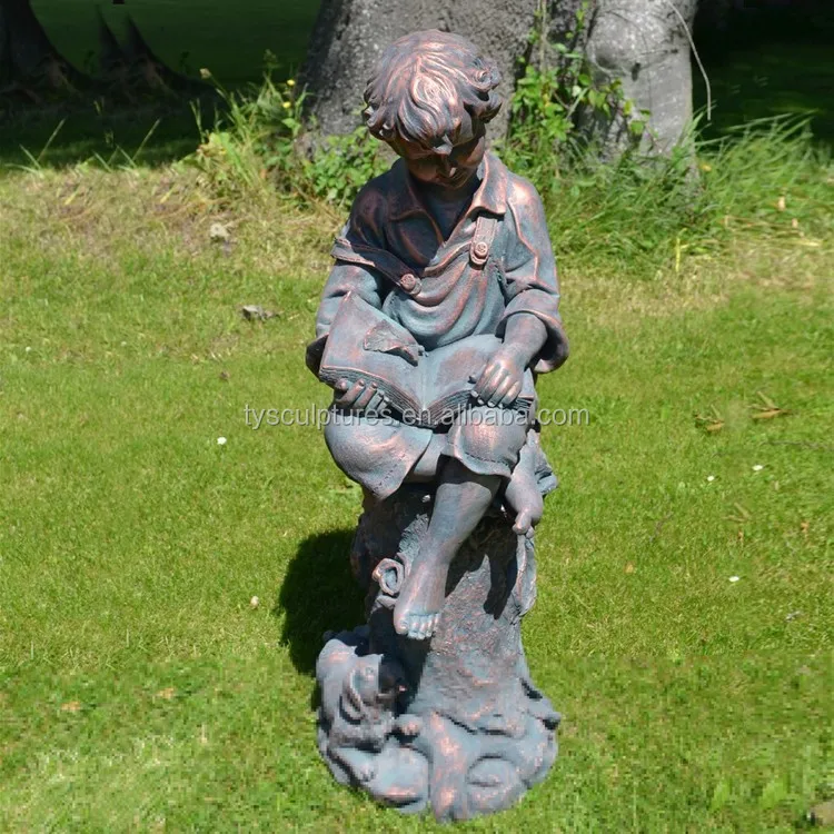 子供と本を読む少女の彫刻