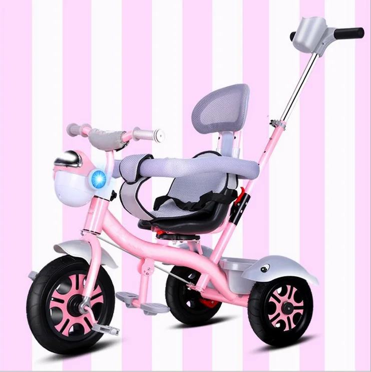 pink tricycle with push handle